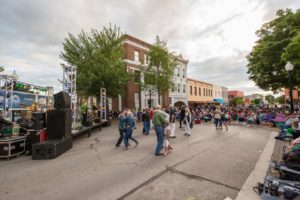 band performing in downtown brenham people dancing in the street