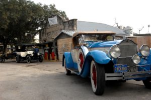 classic cars at old fuel station