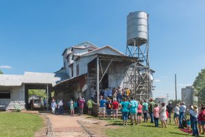 People are lined up to enter the Burton Cotton Gin Museum