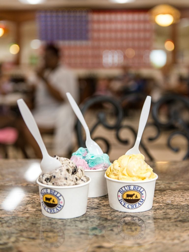 The scoops of blue bell ice cream in the different cups.