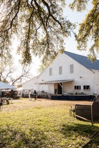 La Bahia Barn with people out front during their annual antique show.