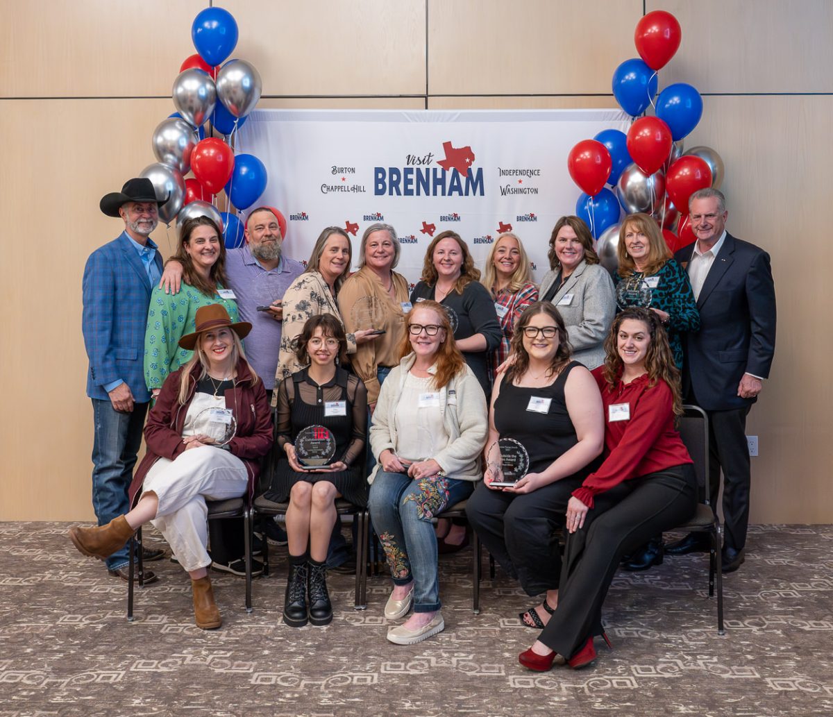 Tourism Partner Awards recipients pose with their awards.