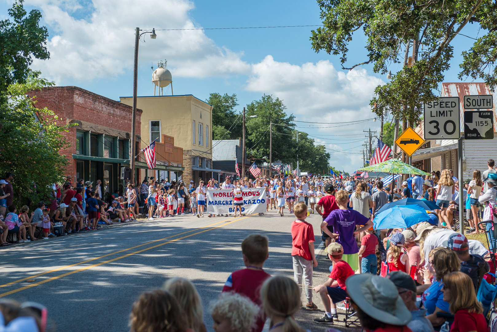 Kids march with kazoos in the Chappell Hill Independence Day Parade